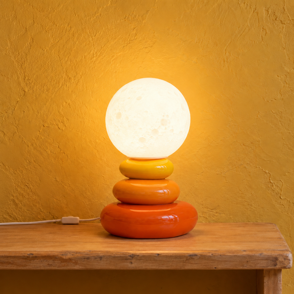 Stacked ceramic pebble table lamp, moon effect globe